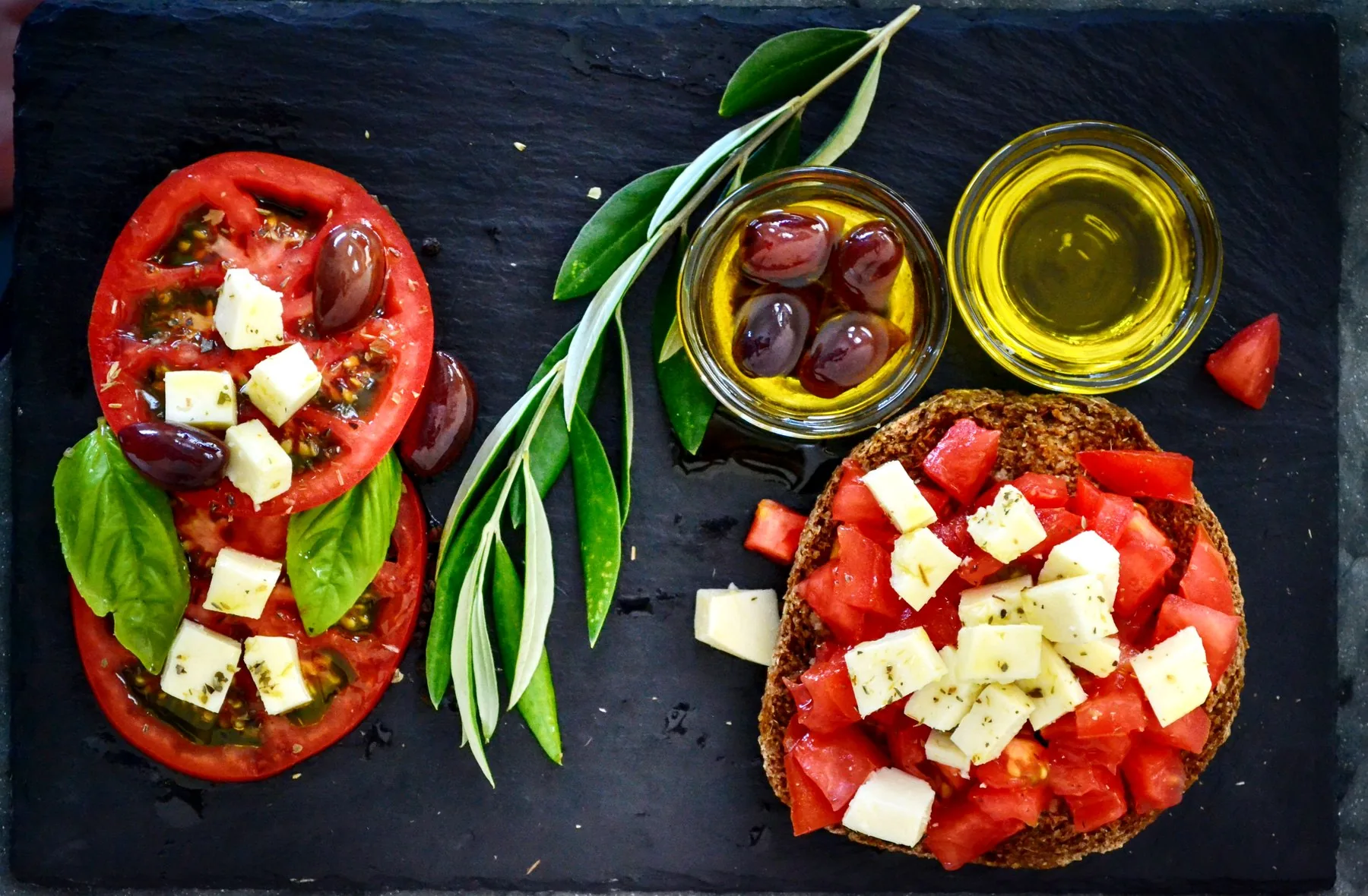 Mediterranean food products with tomatoes, olives and olive oil